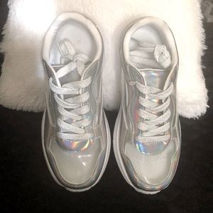 Girls silver holographic peep toe shoe.